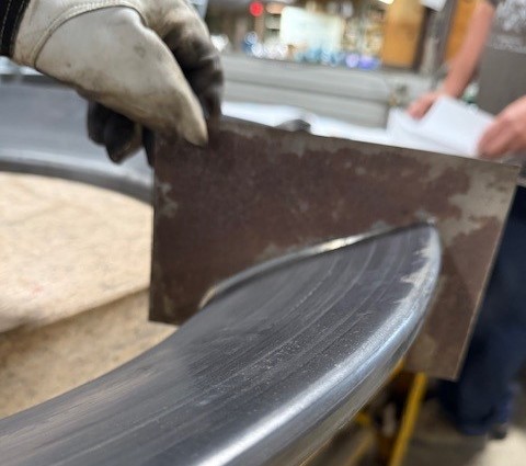 The legacy manual sheet-metal jig inspection it replaces.