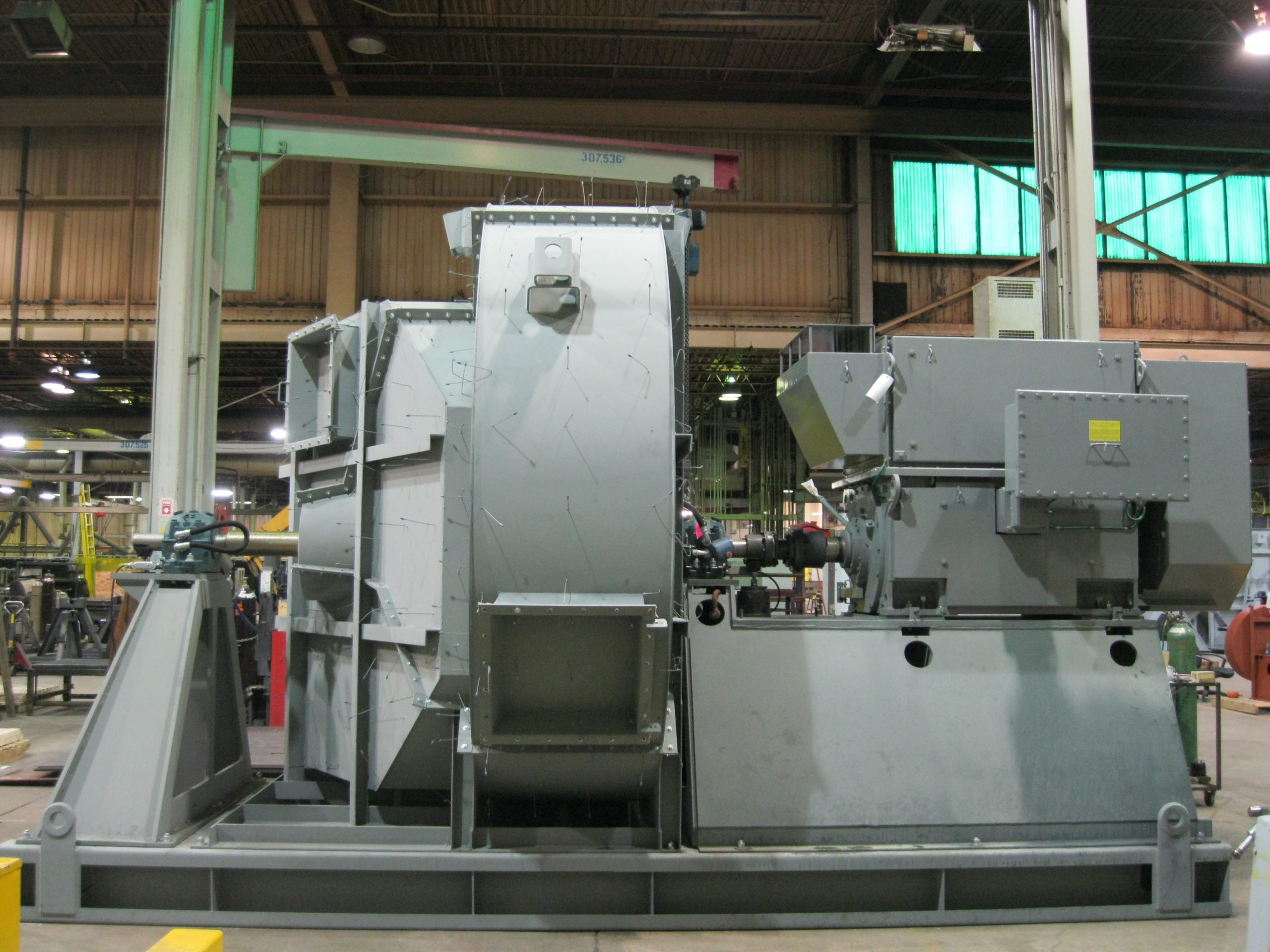 A custom Northern Blower Inc. centrifugal fan, the end product the cones feed into.