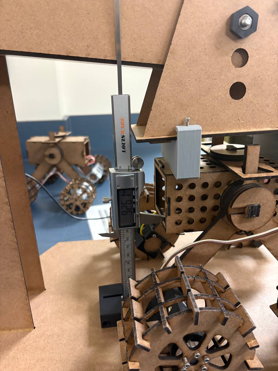 Static load test with threaded rod and caliper.
